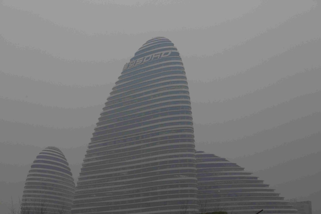 A building on the Beijing skyline as seen on a smoggy day. Photo: Reuters