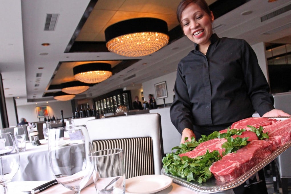Server Mariluna Manganop with some choice cuts at Morton's in Tsim Sha Tsui. Photo: May Tse
