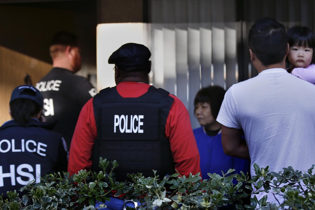 Agents question residents at an apartment complex in Rowland Heights, California, as part of the investigation yesterday. Photo: TNS