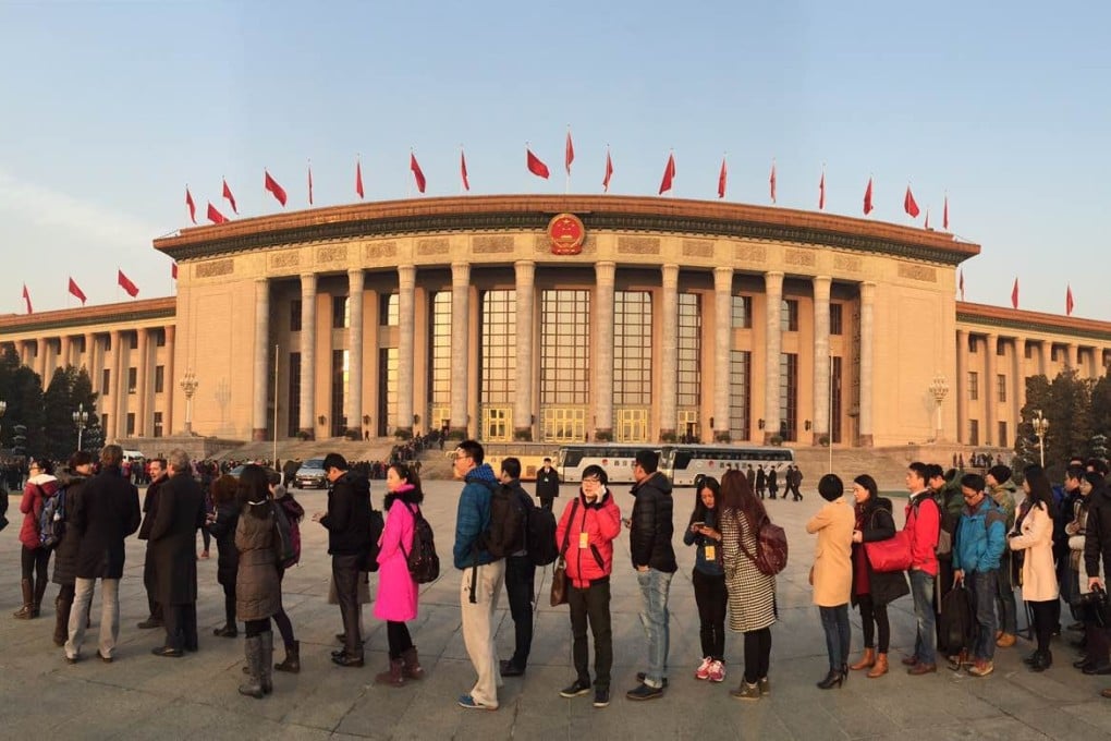Journalists line up this morning outside the Great Hall of the People awaiting copies of Premier Li Kekiang's working report and the start of the annual National People's Congress meeting. Photo: Simon Song