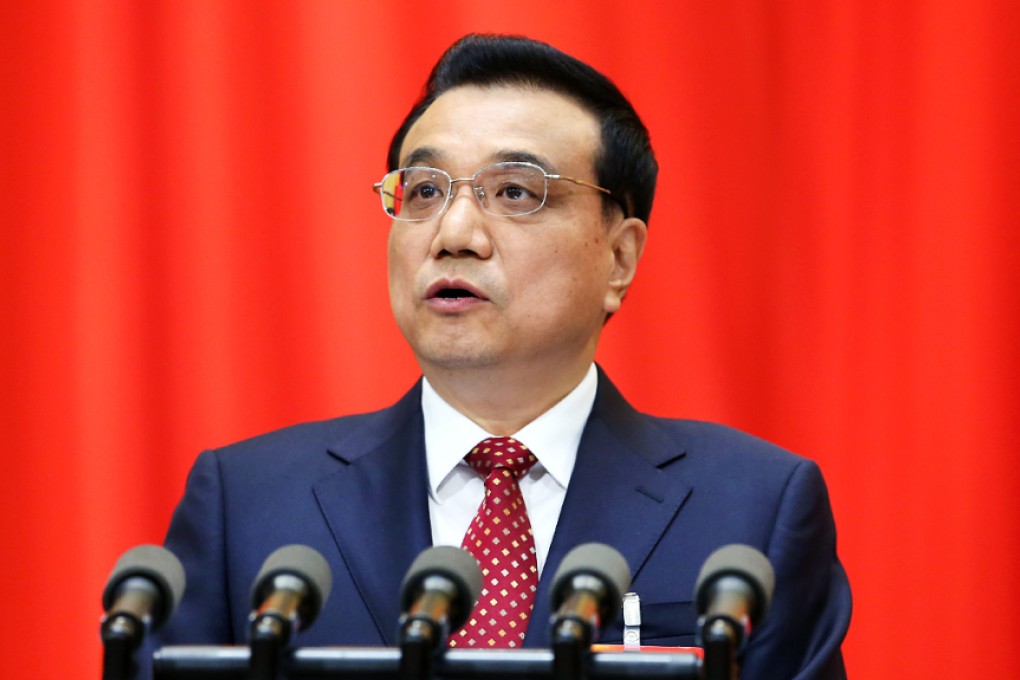 Li Keqiang gives his speech today at Great Hall of the People, in which he admitted that downward pressure on China’s economy was intensifying. Photo: Xinhua