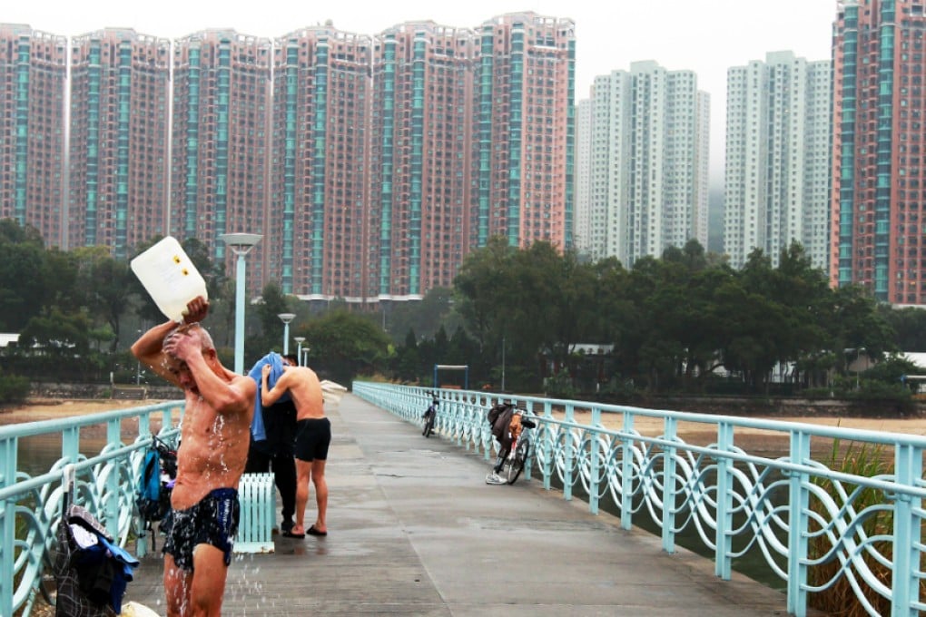 People swim at the waters near a Wu Kai Sha beach in Ma On Shan. The place could be threaten by  reclamation. Photo: David Wong