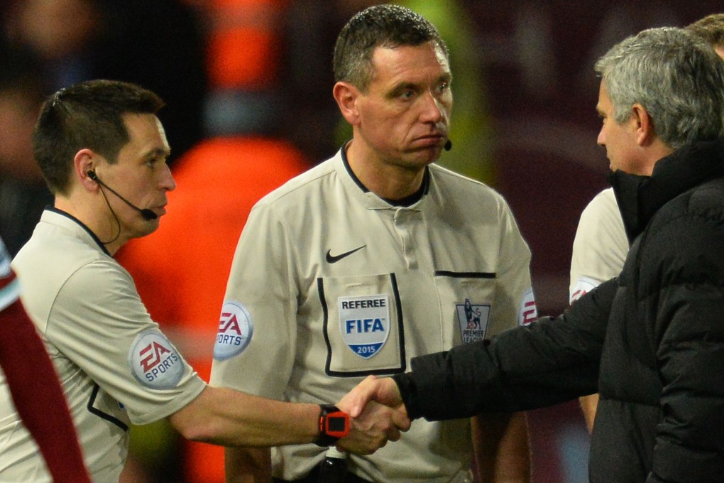 Chelsea's Portuguese manager Jose Mourinho (right) talks to referee Andre Marriner (centre). Disputes with referees over decisions can quickly be resolved if technology is used. Photo: AFP