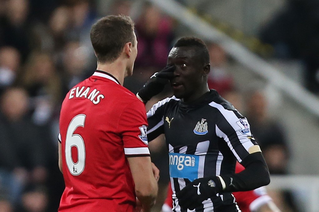 Evans and Cisse square up. Photo: Reuters