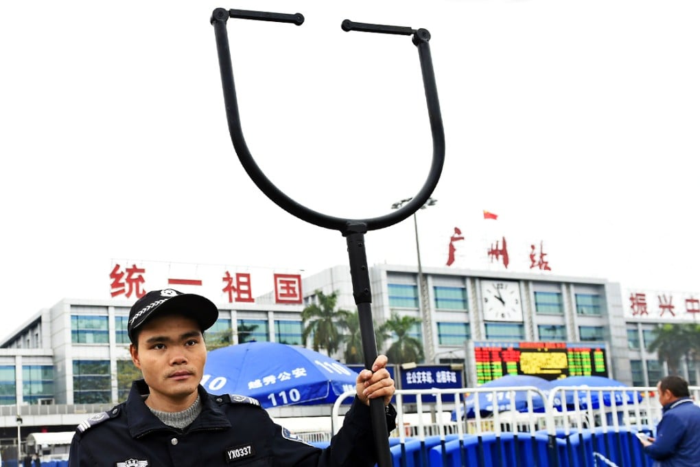 A security personnel keeps guard at the railway station in Guangzhou, Guangdong. Photo: Xinhua