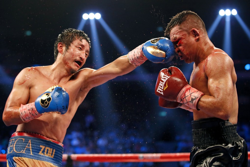 China's Zou Shiming in action against Colombian boxer Luis De La Rosa during the WBO international flyweight title match in Macao. Zou is aiming for a world title on Saturday night. Photo: AP