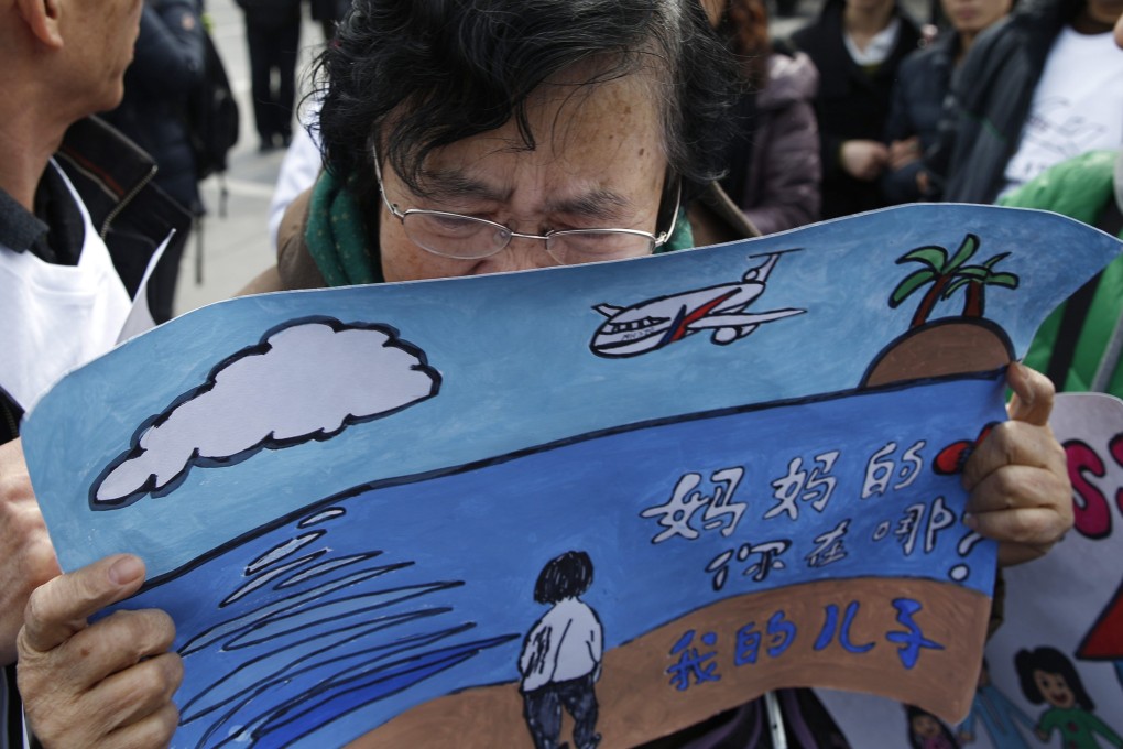 Wang Guohui, mother of a passenger of the missing Malaysia Airlines flight MH370, cries during a gathering of family members of the missing passengers in Beijing. Photo: Reuters