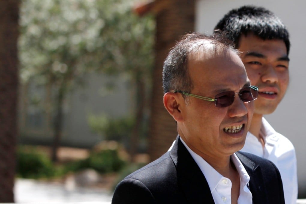 Paul Phua (front) becomes the last man standing in illegal Las Vegas gaming racket case as his son Darren (background) was handed five years of unsupervised probation. Photo: AP