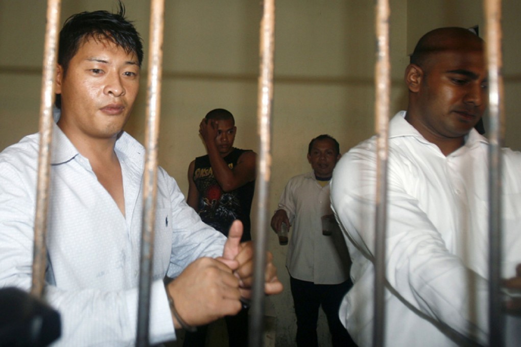 Bali Nine ringleaders Andrew Chan (left) and Myuran Sukumaran in one of the last public photos taken of them in a Bali jail before being transferred to Nusakambangan island for execution. Photo: Reuters