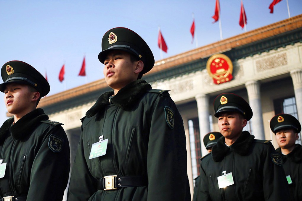 Chinese paramilitary officers march on Tiananmen Square prior to the opening session of the 12th National Peoples Congress (NPC) at the Great Hall of the People. Photo: EPA