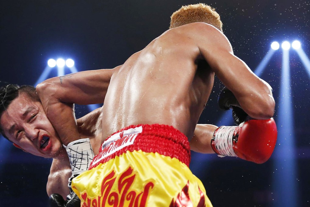Double Olympic champion Zou Shiming has vowed to come back from his defeat by Thailand's Amnat Ruenroeng. "Without losing, you cannot taste the sweetness of victory," said Zou. Photo: Reuters