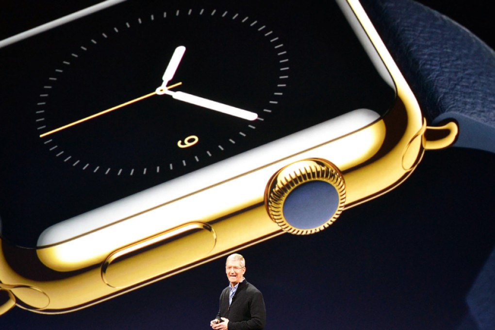 Apple Inc. CEO Tim Cook unveils details of the Apple Watch smartwatch during an event in San Francisco on March 9, 2015. Photo: Kyodo