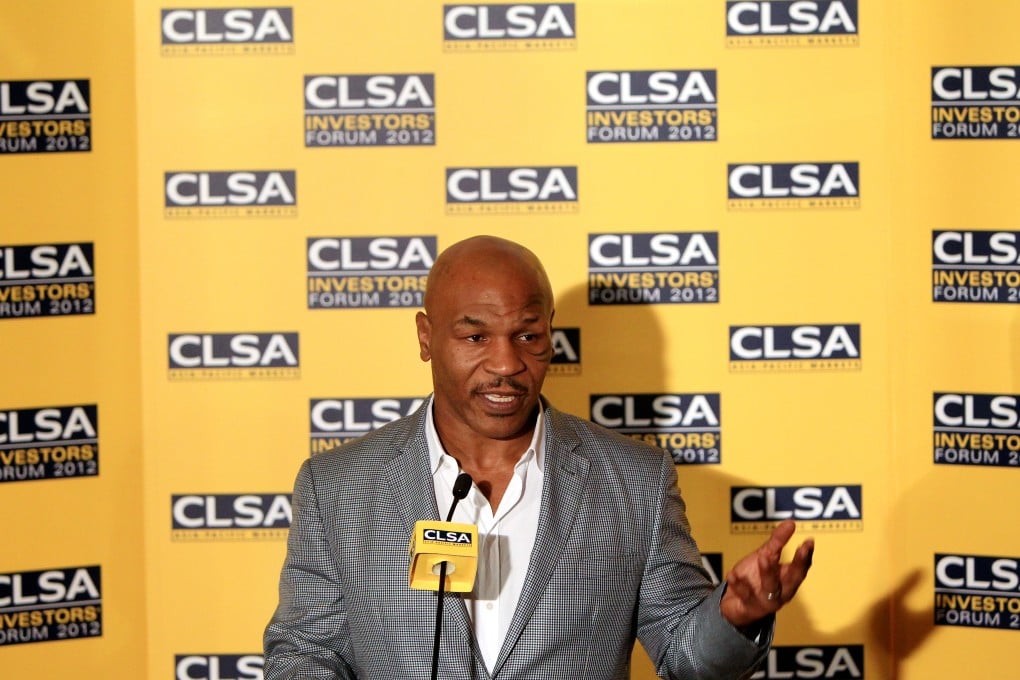 Former boxing heavy-weight champion Mike Tyson meets the press after speaking at a CLSA Investors' Forum. Photo: Jonathan Wong