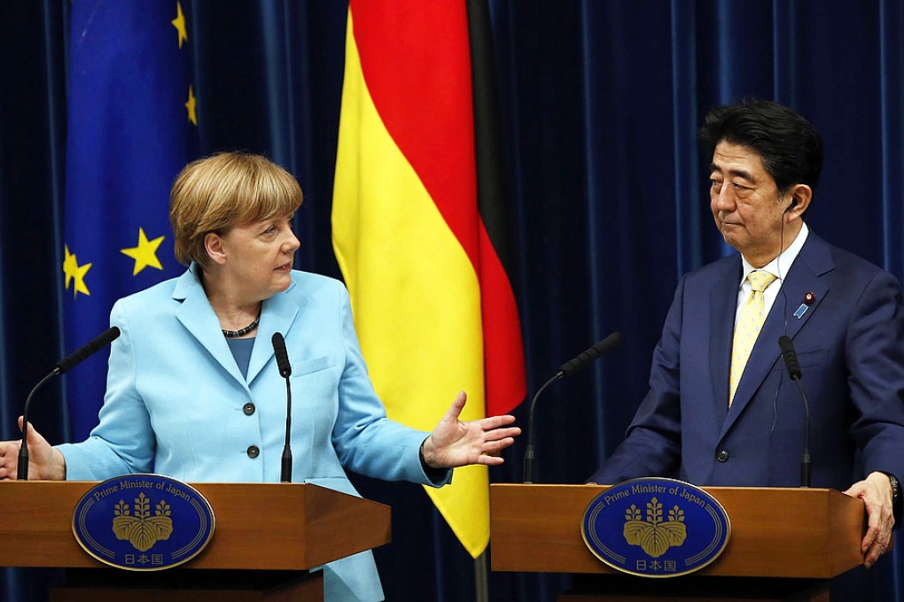 German Chancellor Angela Merkel meets Japanese Prime Minister Shinzo Abe in Tokyo yesterday. Photo: Reuters