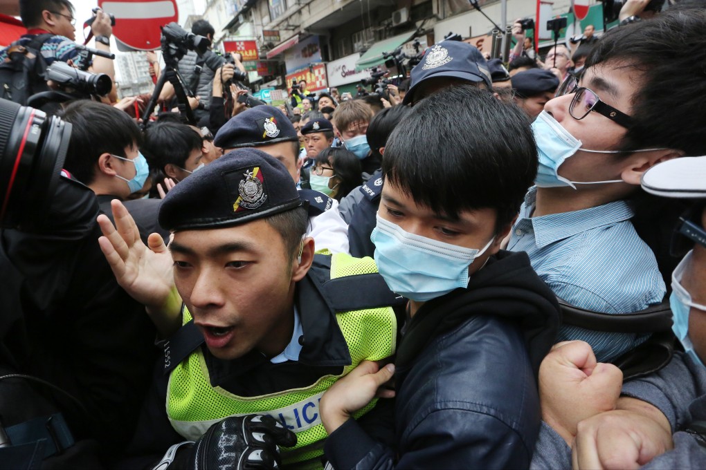 Members of HK Indigenous and Civic Passion clash with police during a rally against parallel trading in Yuen Long. Photo: Felix Wong