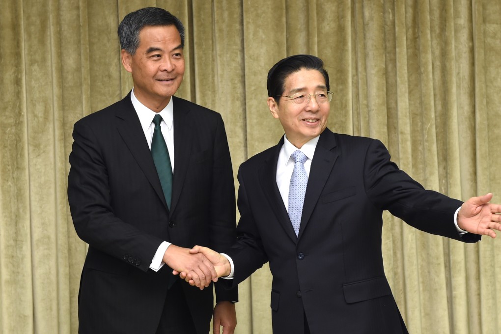 Leung Chun-ying meets with Public Security Minister Guo Shengkun at the annual sessions in Beijing. The chief executive appears to enjoy the full confidence of the central government. Photo: Xinhua