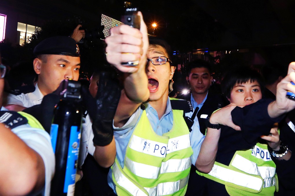 Police arrest a protester during the anti-parallel trading rally in Tuen Mun on Sunday. Photo: Felix Wong