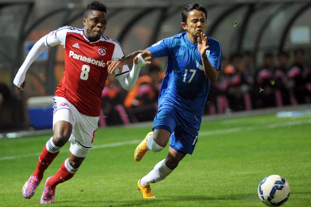 Speedy South China winger Mahama Awal battles for the ball with Ye Win Aung of Yadanarbon in their AFC Cup match at Mong Kok Stadium. South China won 3-1. Photos: Xinhua