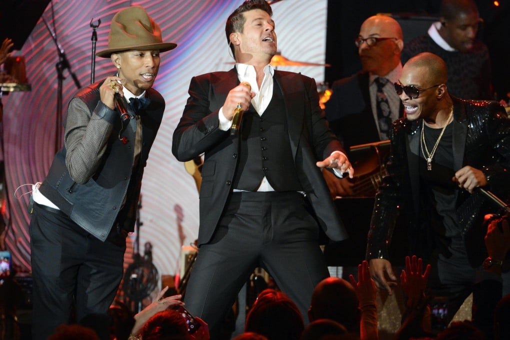 From left: Pharrell Williams, Robin Thicke and T.I. perform 'Blurred Lines'. The latter artist was cleared of any wrongdoing in the lawsuit. Photo: Reuters