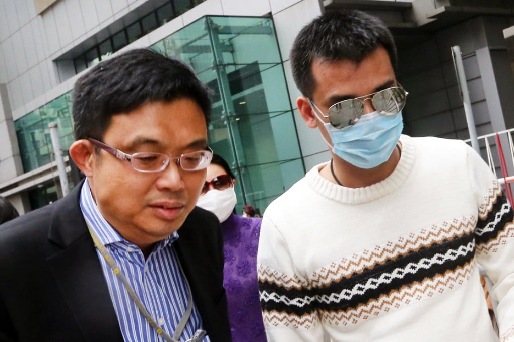 Democratic Party legislator James To (left) accompanies Ma to police headquarters in Wan Chai yesterday. Photo: David Wong