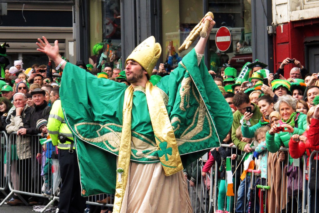 A man dresses and dances along the parade route of the St. Patrick's Day festival in Dublin in 2014. Photo: AP