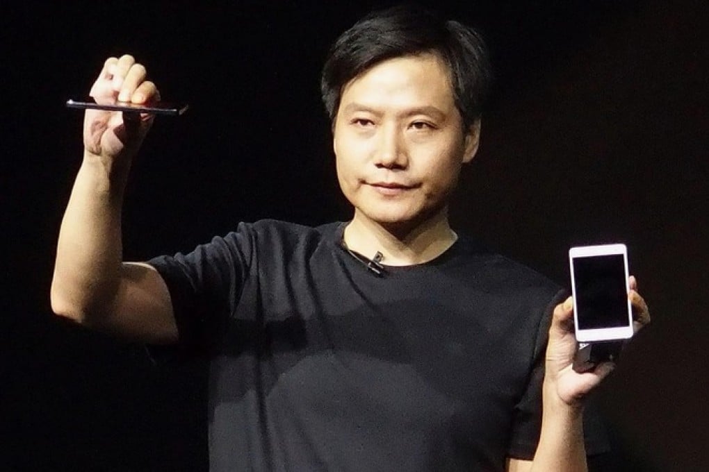 Xiaomi's Lei Jun gives a briefing, Steve Jobs-style, on a new smartphone in Beijing in July, Photo: Kyodo