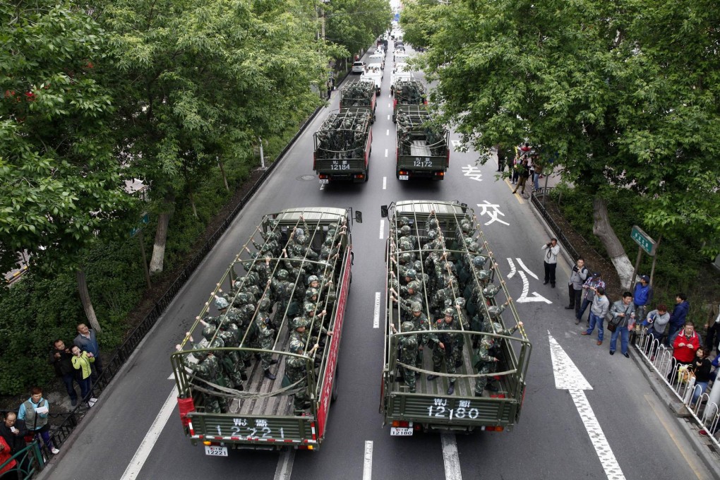 Paramilitary police on a street in Urumqi, Xinjiang. Photo: Reuters