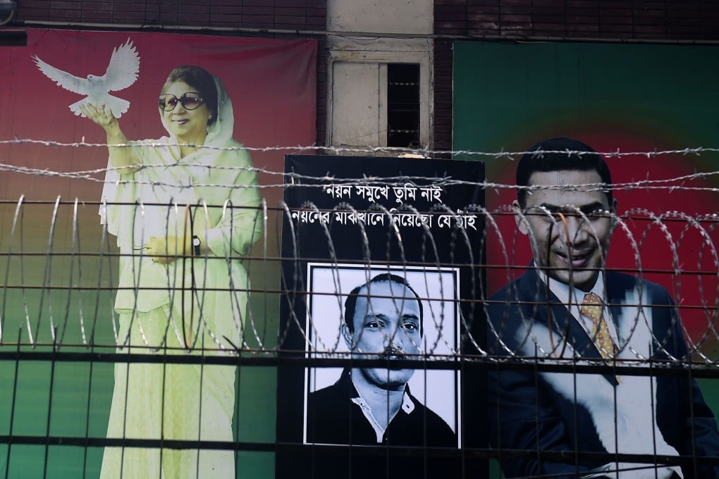 A poster of Khaleda Zia is seen, with those of her two sons, in front of the Bangladesh Nationalist Party office last month during a nationwide blockade. Photo: AFP
