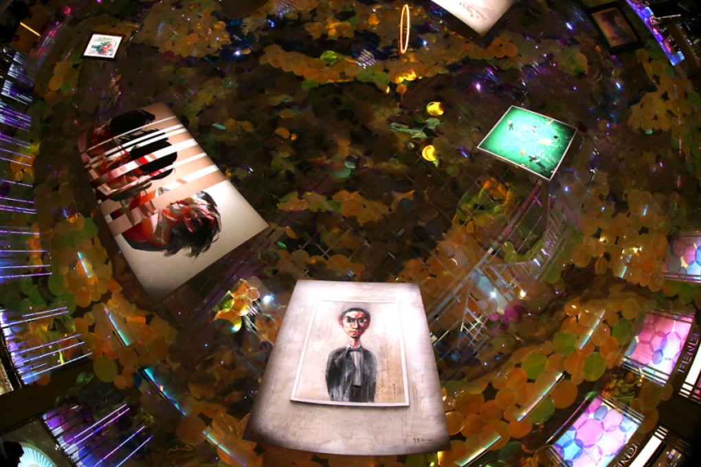 Take Another View on Art invites visitors to The Landmark atrium to take a telescopic view of nine artworks suspended from the ceiling. Photo: Nora Tam