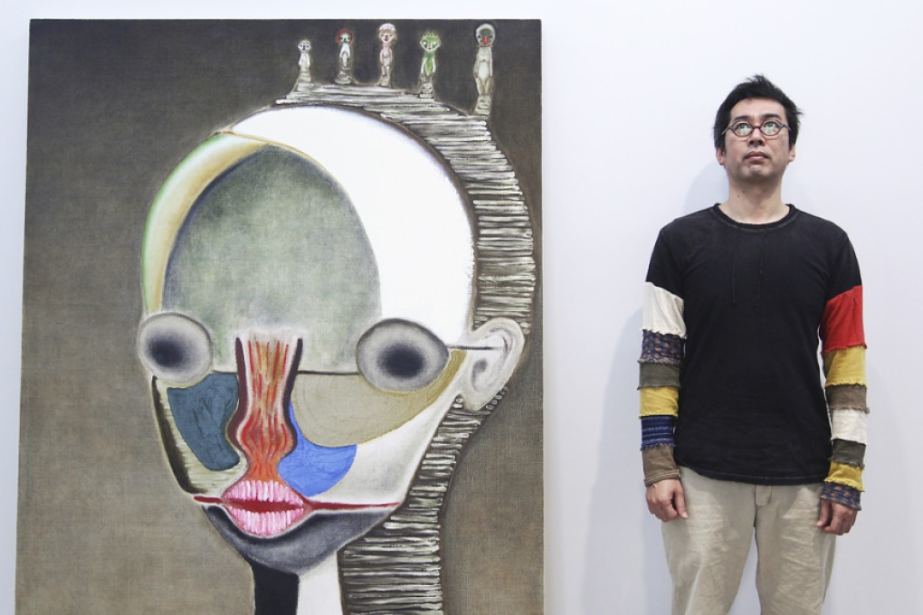 Japanese artist Izumi Kato with his artwork Untitled, 2013 at Galerie Perrotin in Central last year. Photo: Jonathan Wong