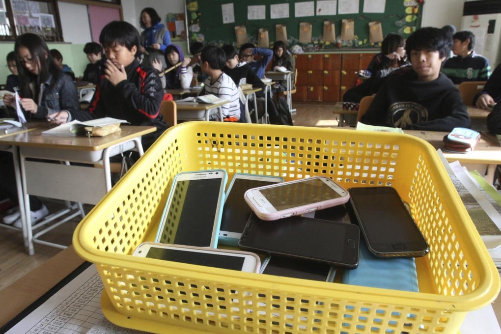 Smartphones from students in Suwon, South Korea. Photo: AP