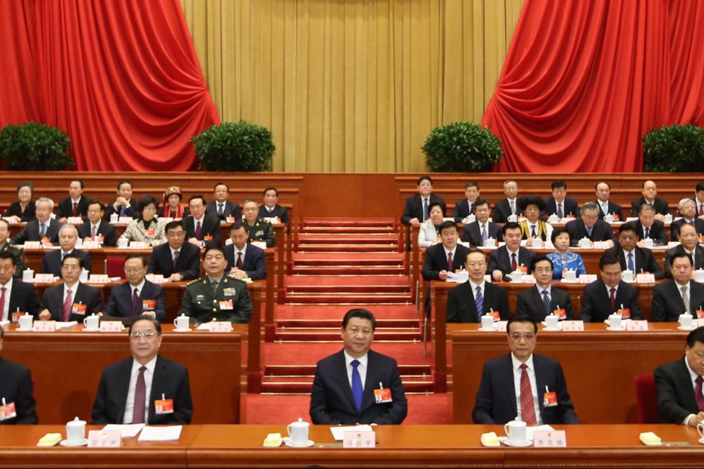 President Xi Jinping (centre) and Premier Li Keqiang (to his left) at the opening of the NPC. Photo: Xinhua