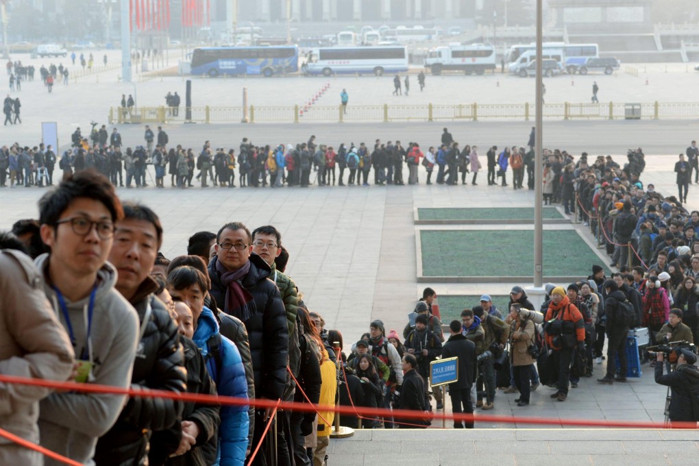 Reporters queuing to get into a National People's Congress session in Beijing. Photo: Kyodo.