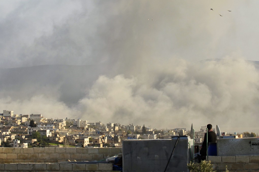 Smoke rises after an air strike on Atimah, in Idlib province, close to the border with Turkey. Three British teenagers wanted to cross the border into Syria. Photo: Reuters