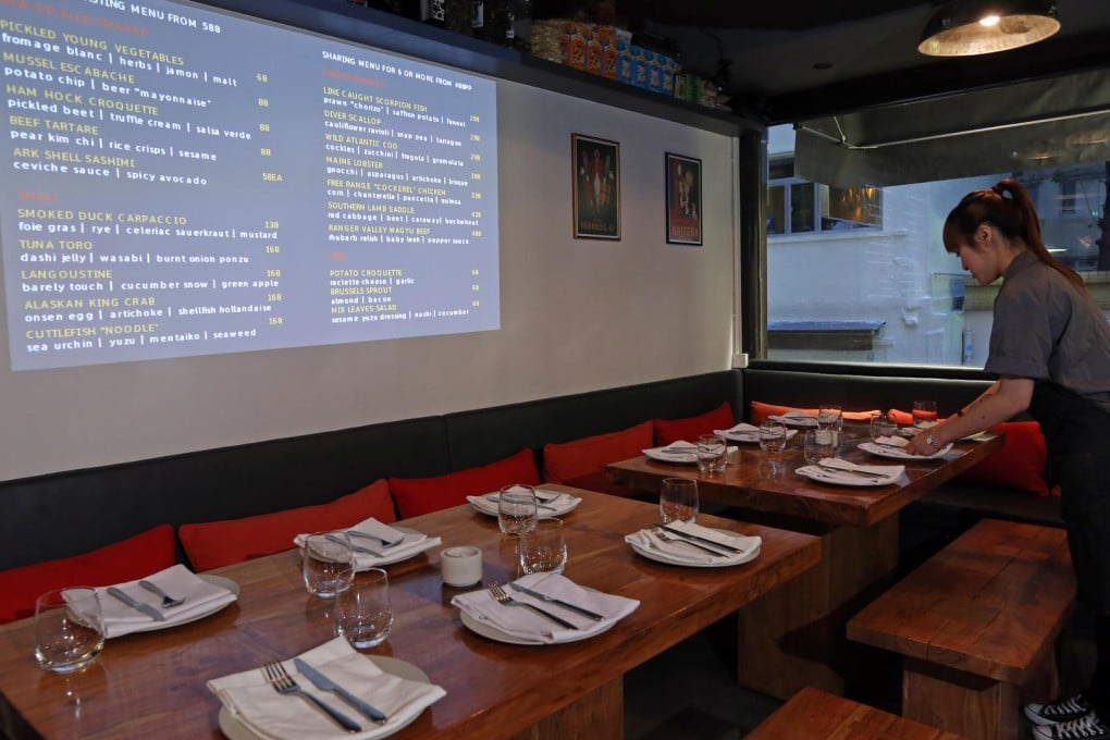 the menu is projected on a wall. Photos: Nora Tam