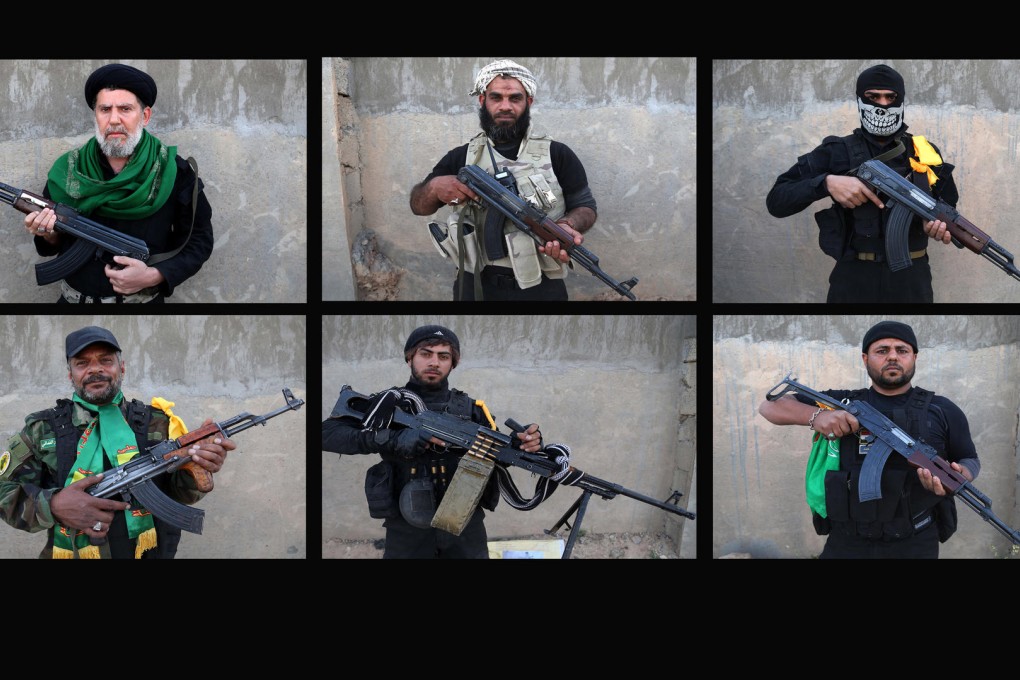 Shiite militiamen pose for photographs during a break in fighting against Islamic State forces near the front line in Tikrit. Photo: AP