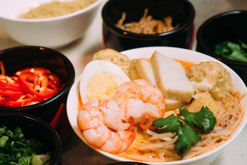 Enjoy a laksa at The Grand Buffet.