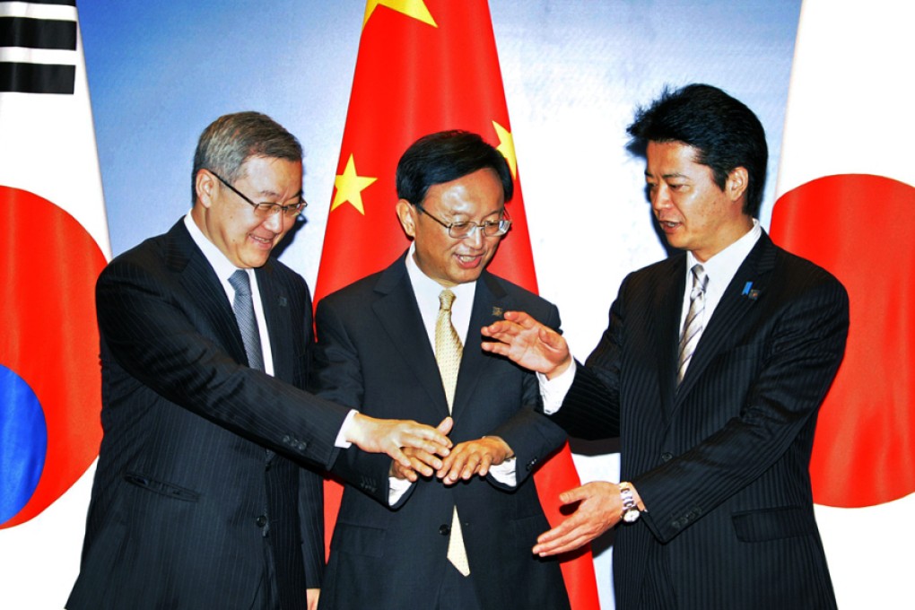 China's former foreign minister Yang Jiechi, centre, pictured with his South Korean and Japanese counterparts at the last meeting between the three countries top foreign envoys in 2012. Photo: AP