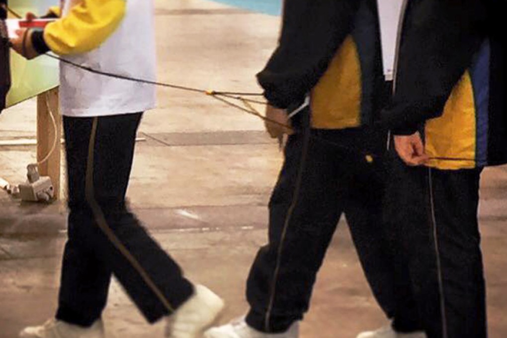 The children's hands were tied together during the tour. Photo: SCMP Pictures