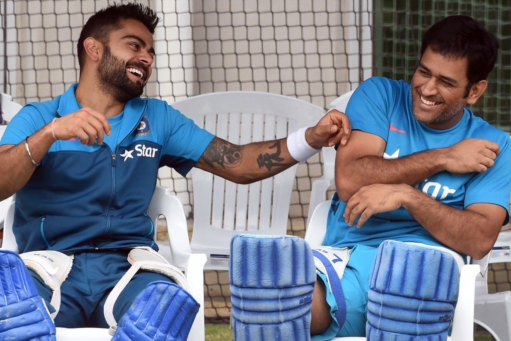 India's Virat Kohli (left) and captain Mahendra Singh Dhoni share a lighter moment during a training session ahead of their Cricket World Cup quarter-final match against Bangladesh in Melbourne. Photos: AFP