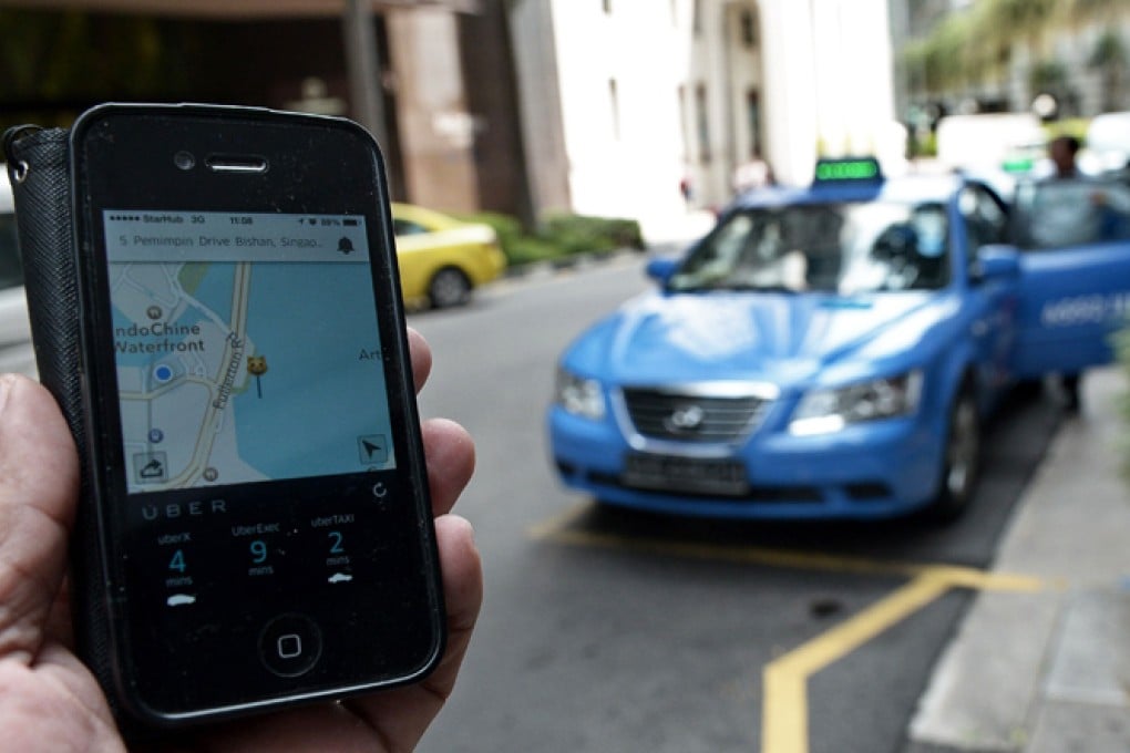 Ride-hailing app Uber (its app shown above) has failed to gain significant market share on mainland China since it debuted there last year so a merger could prove beneficial. Photo: AFP