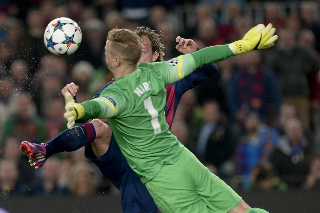 Barcelona's Ivan Rakitic scores past Manchester City keeper Joe Hart. Photo: AFP