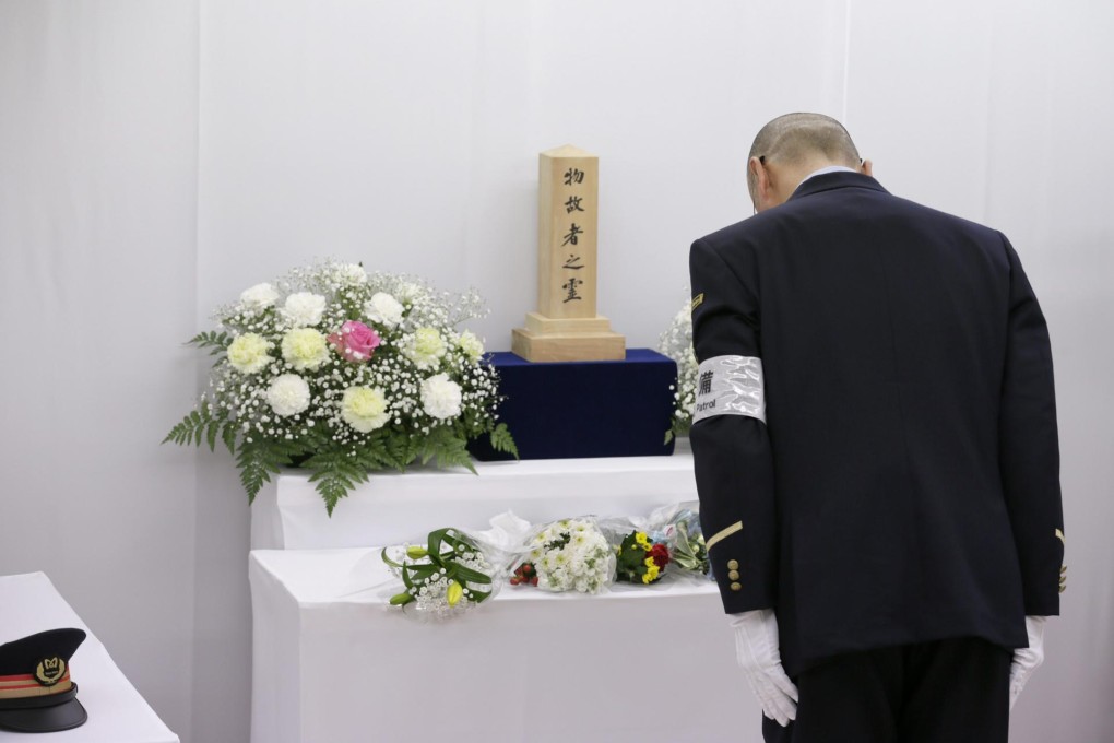 Tributes are offered at Kasumigaseki station.Photo: EPA