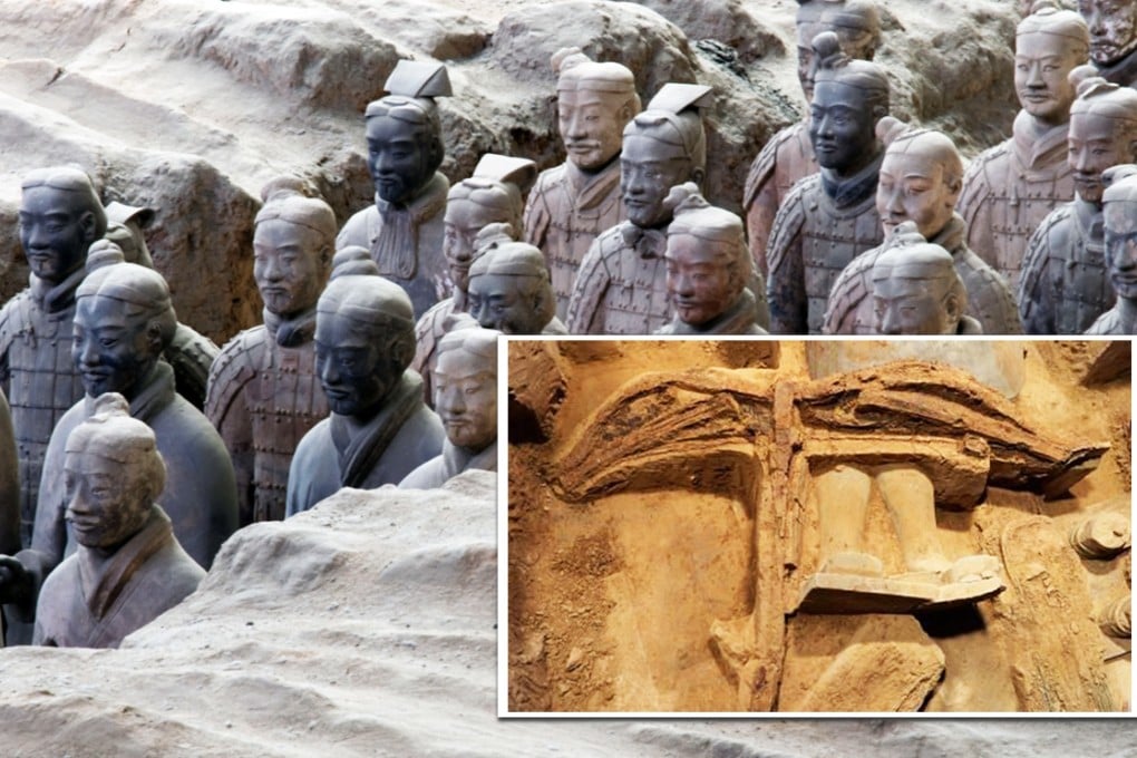 The well preserved crossbow remains half buried in the ground beside a terracotta warrior. Photos: SCMP Pictures, AFP