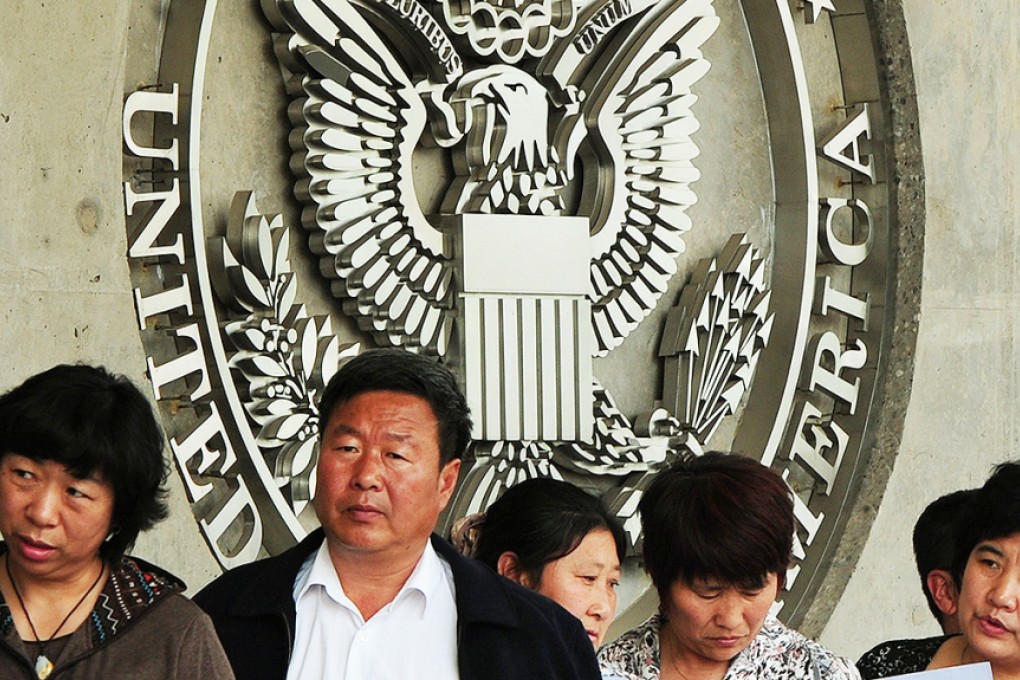 People wait to submit their visa applications at the US embassy in Beijing. Photo: AFP