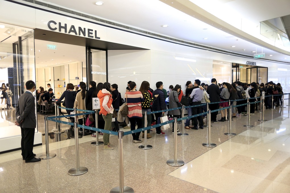 People queue in front of Chanel's store in Shanghai. Photo: Reuters