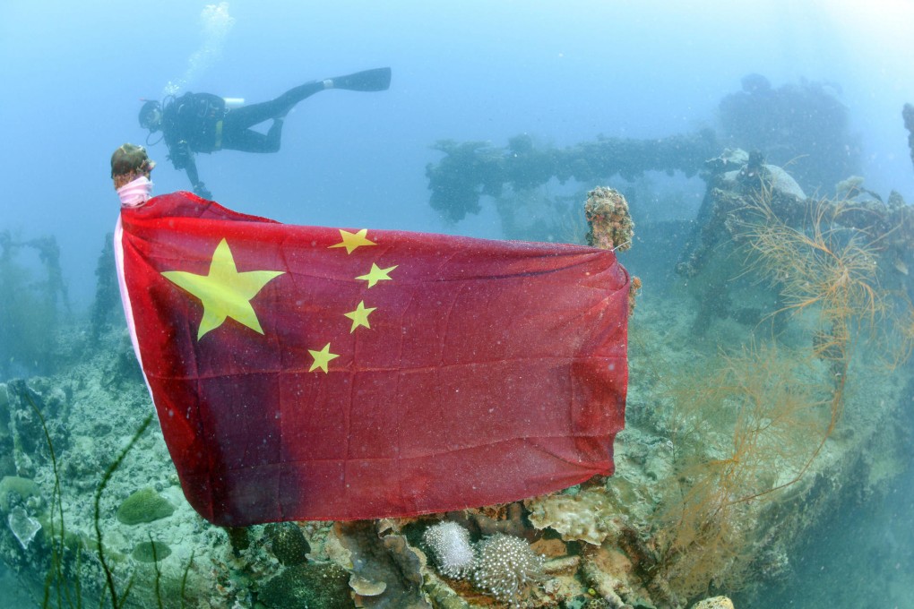 A Chinese national flag tied to the wreckage of the Iro, an oil tanker for the Imperial Japanese Navy. Photo: Kyodo