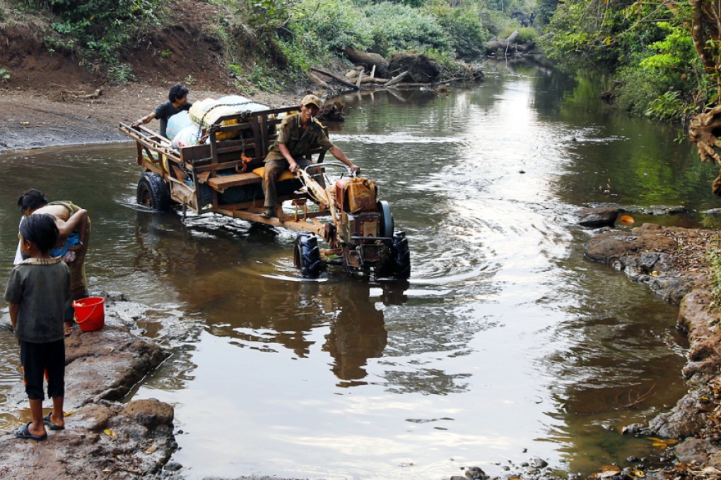 Cambodians in a remote village transporting dried cassava for selling to Vietnam. Many parts of Asia are in critical need of good infrastructure. Photo: AP