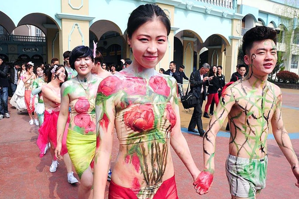 Couples in body paint and dressed only their underwear hold 'naked weddings in Zhejiang province as a protest against modern Chinese values, which places greater focus on money than love. Photo: SCMP Pictures