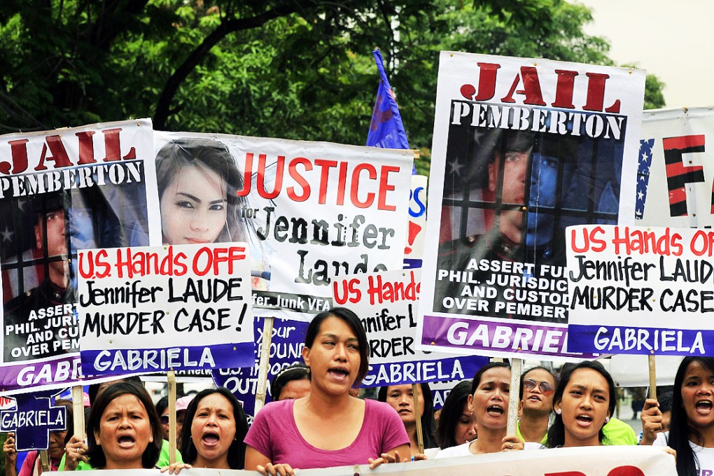 Activists from women's rights group GABRIELA, display anti-U.S. government placards during a protest against the killing of Filipino transgender Jennifer Laude, while marching towards the U.S. embassy in Manila on March 24, 2015. Photo: Reuters